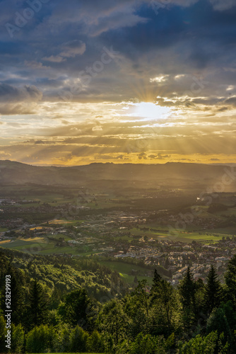 sunset over the fields in stormy clouds