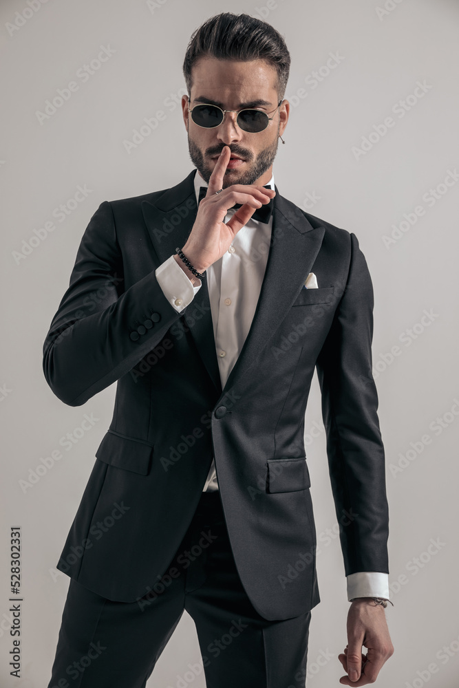 irresistible young groom making silence gesture irresistible young groom making silence gesture