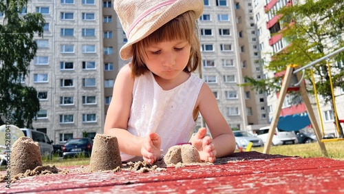 Wallpaper Mural SMALL GIRL playing at playground at backyard of blocks of flats Torontodigital.ca