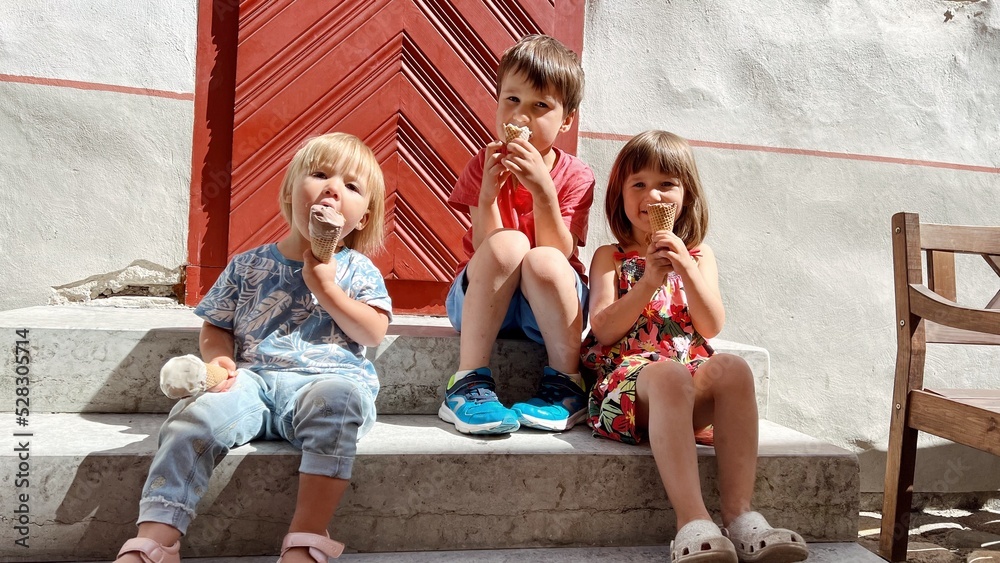 custom made wallpaper toronto digitalThree siblings sitting and eating ice cream on the stairs