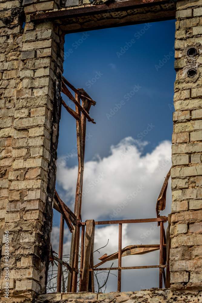 Ruined house. Ruins of a residential building. Brick walls. War in Ukraine. A house destroyed by a rocket and fire. A pile of bricks. A burnt life. Russian peace. Consequences of Russian aggression. Ruined house. Ruins of a residential building. Brick walls. War in Ukraine. A house destroyed by a rocket and fire. A pile of bricks. A burnt life. Russian peace. Consequences of Russian aggression.