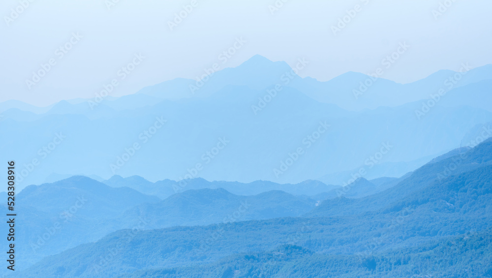 Mountain range silhouette in a blue haze