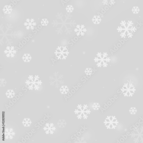 White blurred snowflake graphic pattern on a light gray silver background