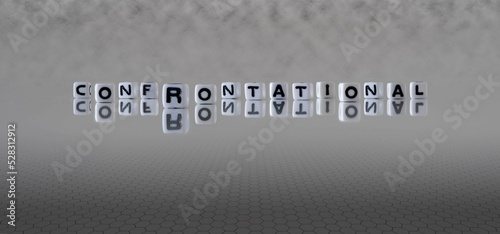 Photo confrontational word or concept represented by black and white letter cubes on a
