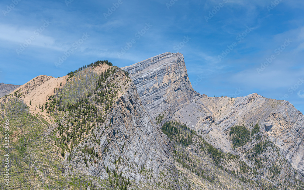 Great Rocky Mountains under magnificent clouds and sunlight, at Banff National Park, Calgary, Canada