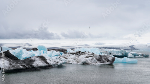iceberg melts in the turquoise ocean bay. Huge high ice glacier in a polar nature environment. Arctic winter landscape in the problem of global warming. Timelapse of the ice and white snow of the dese