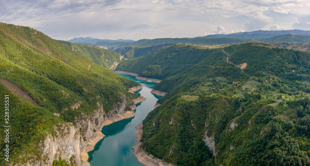 Aerial view of Beautiful Piva river canyon with reservoir Piva Lake (Pivsko Jezero) summer view in Montenegro. Nature travel background. - obrazy, fototapety, plakaty 