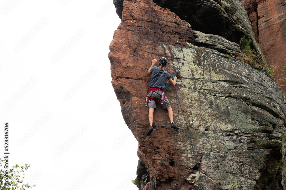 Fototapeta premium Kletterer an einem Sandstein Felsen