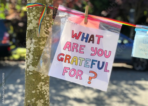 A handmade sign prompts neighbors to consider and share what they're grateful for