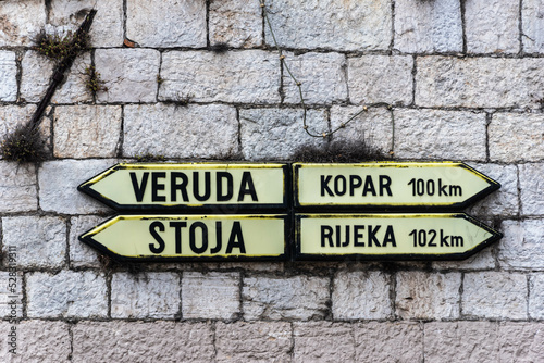 signpost to various directions in istria, croatia photo