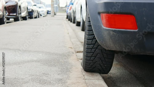 Poor parking: Car was left with one of it's wheels on a pedestrian pavement walkpath photo