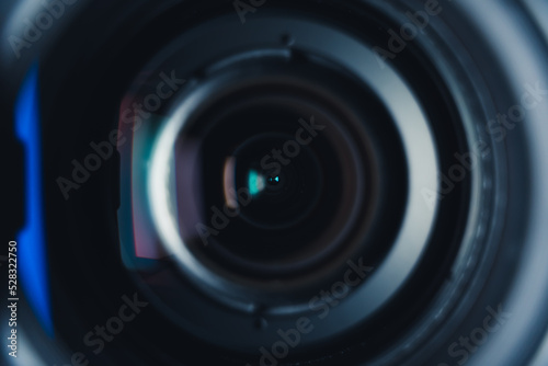 Close-up professional camera lens with color reflections. High quality photo