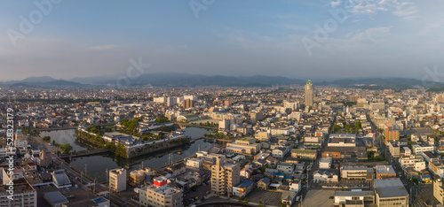 Panoramic aerial view of Japanese castle and Imabari city center  photo