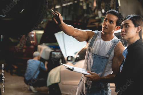 Slika na platnu customer making inspection check to a car engine repair occupation job at garage