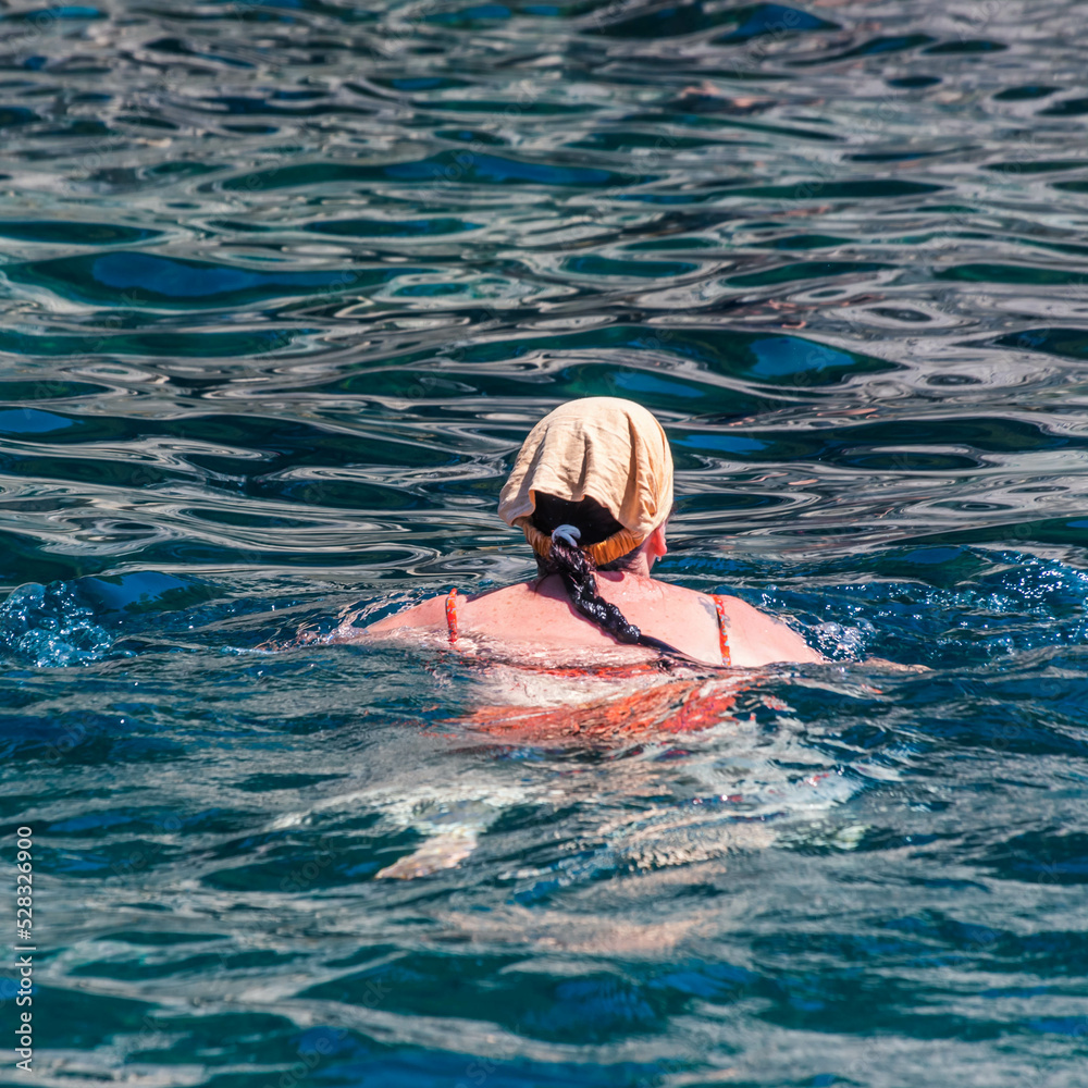 Woman swimming in the water