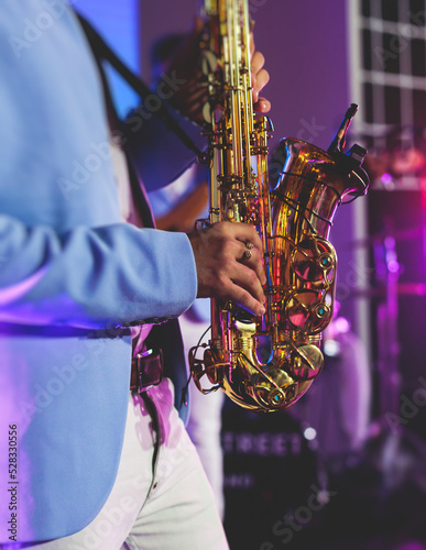 Photography Concert view of saxophonist, a saxophone sax player with vocalist and musical ba