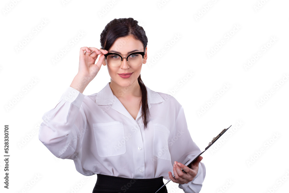 Beautiful young brunette girl in glasses, office or firm worker, standing with black document pad touching her glasses in white blouse and black skirt isolated on white background Beautiful young brunette girl in glasses, office or firm worker, standing with black document pad touching her glasses in white blouse and black skirt isolated on white background