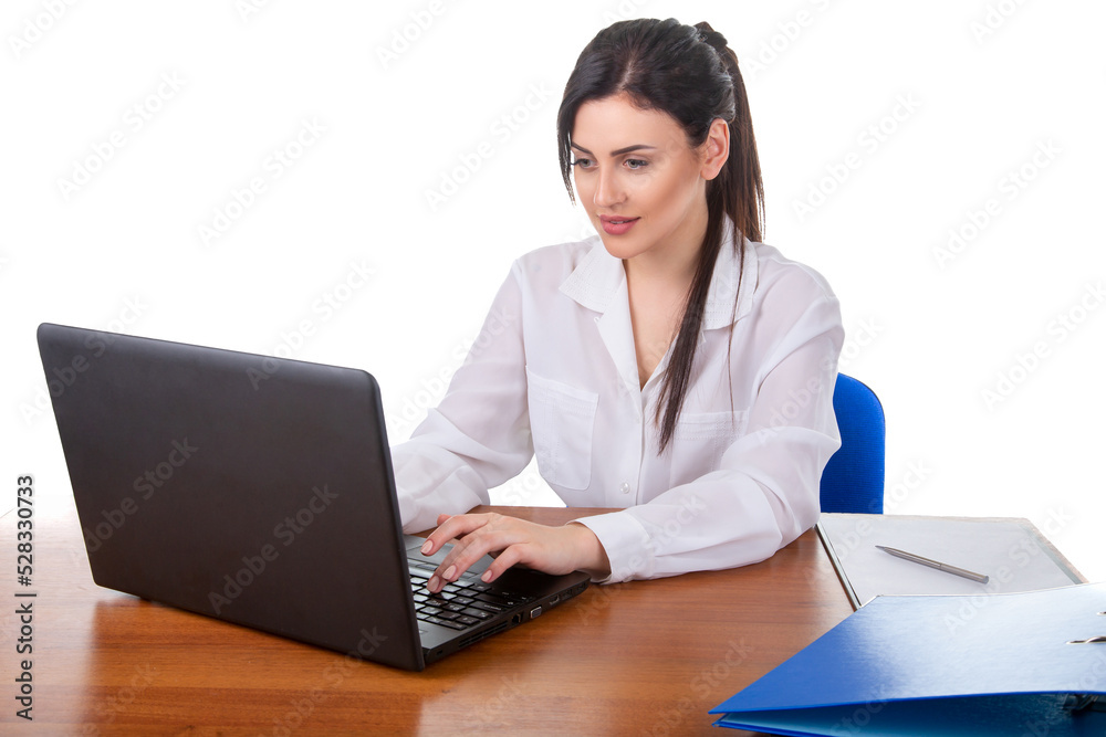 Beautiful young brunette girl typing on a laptop keyboard, office or firm worker, in white shirt isolated on white background