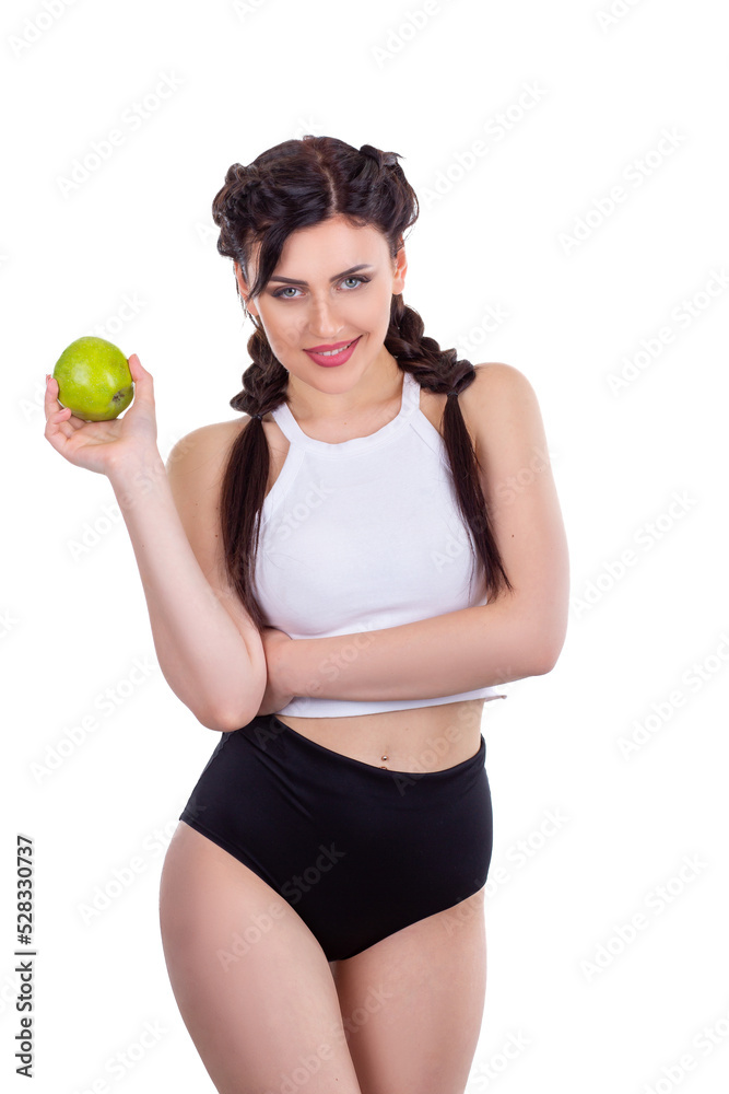 Beautiful young brunette girl holding a green fresh apple isolated on white background Beautiful young brunette girl holding a green fresh apple isolated on white background