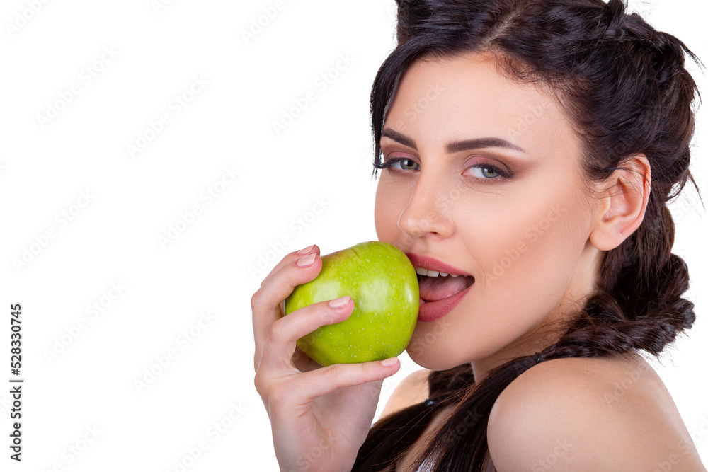 Beautiful young brunette girl eating a green fresh apple isolated on white background Beautiful young brunette girl eating a green fresh apple isolated on white background
