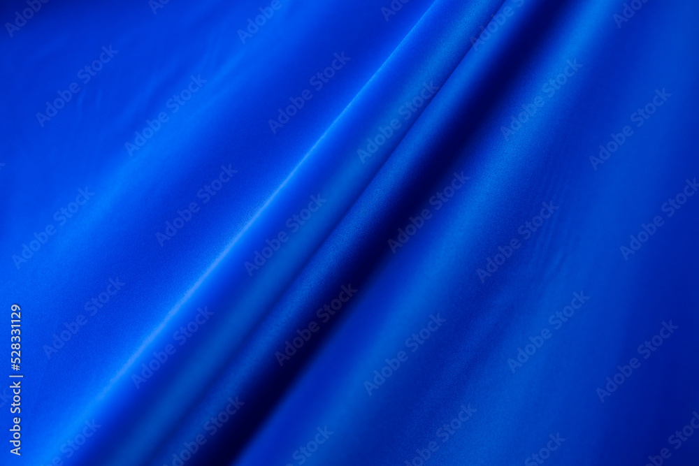 Abstract fabric background for banner. soft silk textile texture in motion for wallpaper