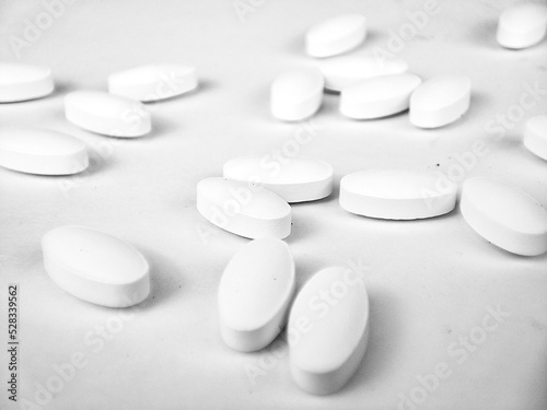 white pills on white background. white medical pills.