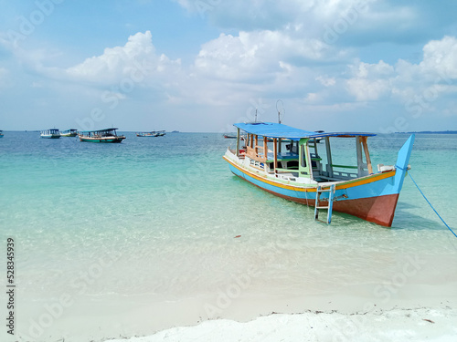 Traditional boat on the beach. Tanjung Kelayang Beach, Belitung Island, Indonesia. © asss__sssa