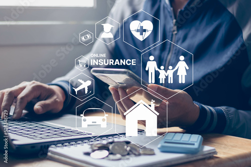 Insurance online insurtech business finance technology concept. Businessman using smartphone and computer to insurance online for life and family, property, health, car, travel, education, financial. photo