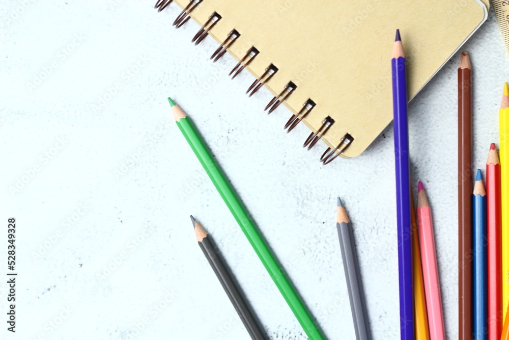 Wooden crayons scattered on the table, wooden rulers and notebooks with the festival back to the semester, students go to school, art lessons.