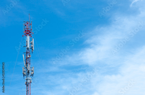 Telecommunication tower for 5G network, on blue sky background, technology photo conceptual.