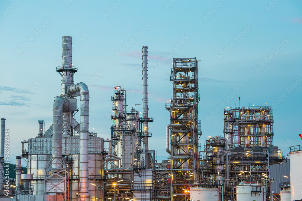 Fototapeta premium Oil​ refinery​ and​ plant and tower column of Petrochemistry industry in oil​ and​ gas​ ​industrial with​ cloud​ red ​sky