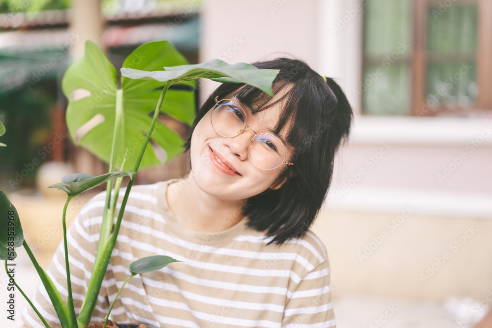 Young adult asian woman wear eyeglasses happy face mental therapy with nature environment Young adult asian woman wear eyeglasses happy face mental therapy with nature environment