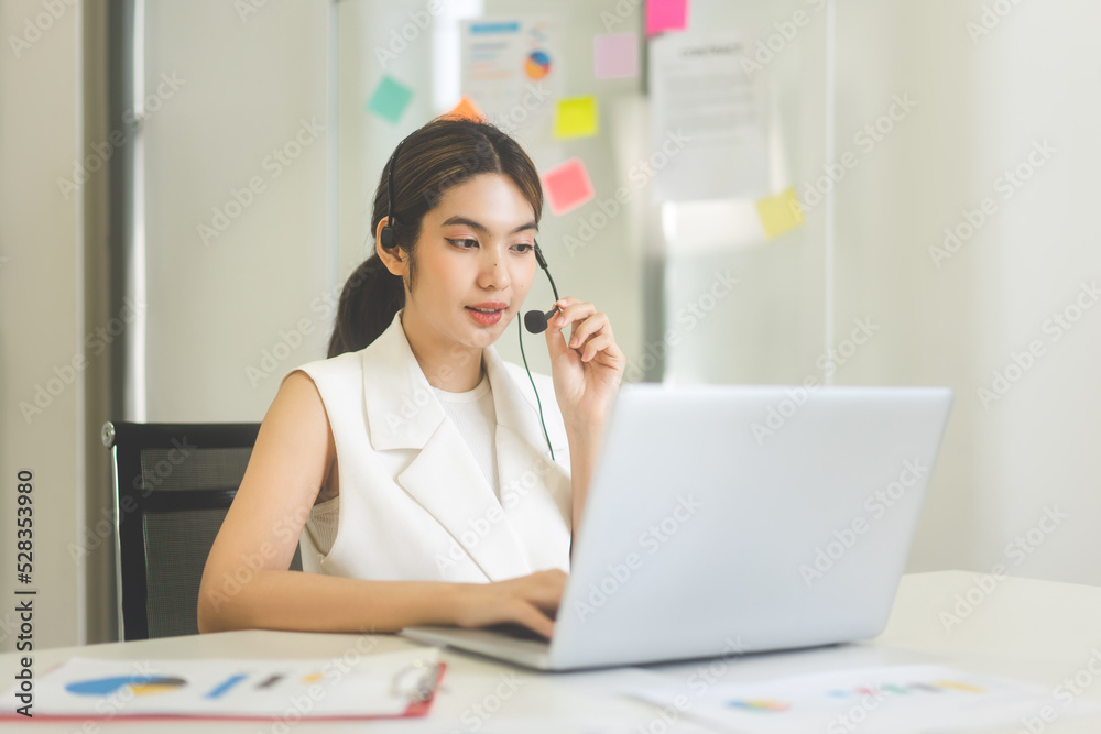 Portrait of young adult southeast call center deparment business asian entrepreneur woman wearing white suit Portrait of young adult southeast call center deparment business asian entrepreneur woman wearing white suit