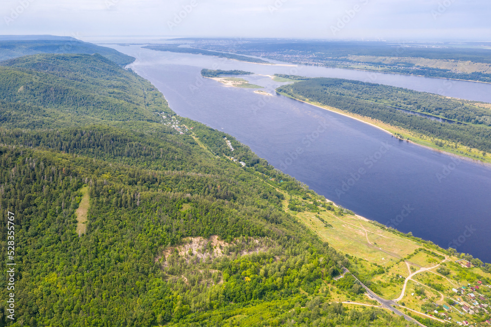 Aerial view of Zhiguli mountains and Volga river on sunny summer day. Zhiguli Nature Reserve, Samara Oblast, Russia.