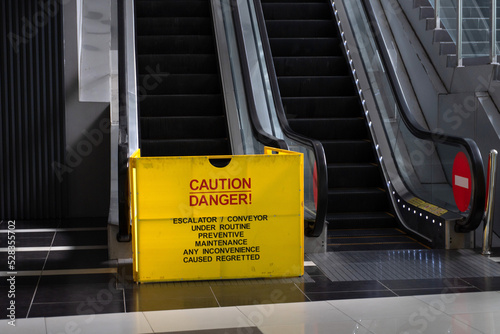 escalator broken notice inside the shopping mall photo