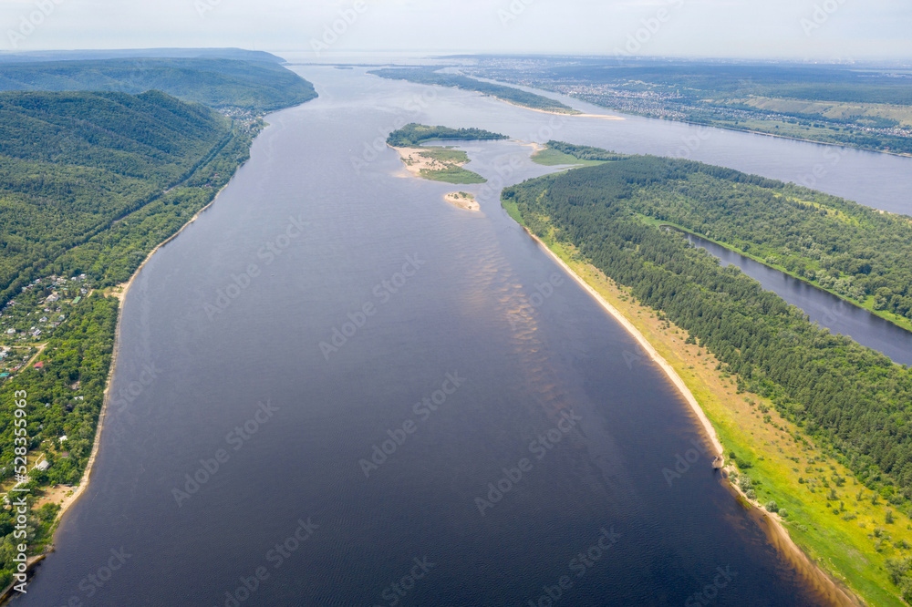 Drone view of Volga river and Sredniy island on sunny summer day. Zhiguli Nature Reserve, Samara Oblast, Russia.