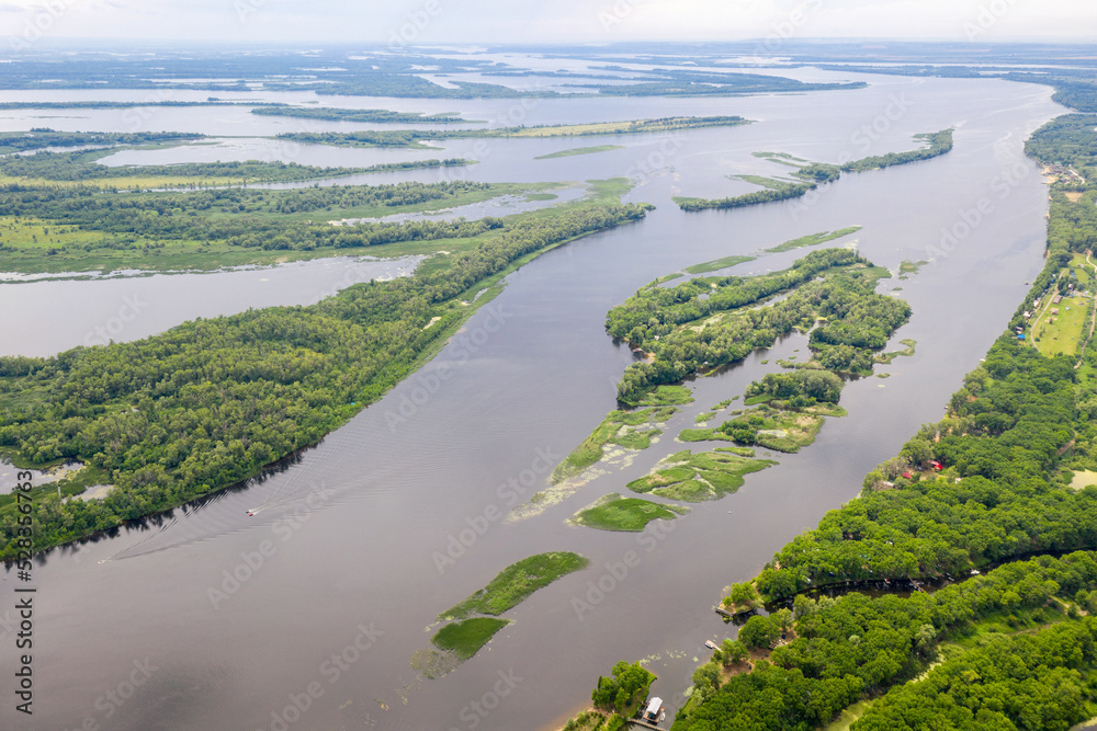 Aerial view of Volga river on sunny summer day. Elshanka village, Saratov Oblast, Russia.