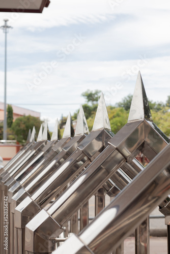 Aluminum spiers lined up fence photo