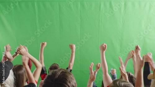 Green Screen Chroma Key Stadium Sports Event: Diverse Crowd of Fans Cheering, Shouting, Clapping, Applauding, Raising Hands Celebrating a Goal, a Win on a Big Soccer Championship. Back View Shot