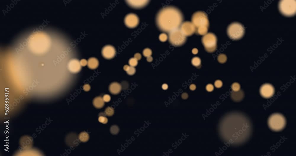Animation of glowing orange spots of light moving in hypnotic motion on black background Animation of glowing orange spots of light moving in hypnotic motion on black background