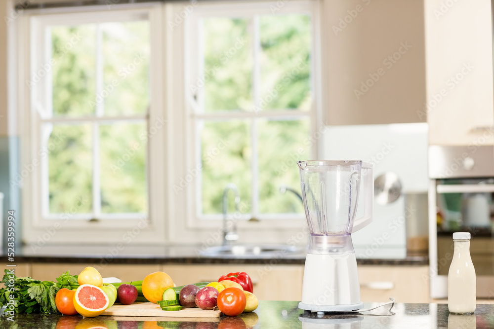 Empty kitchen with vegetables and mixer Empty kitchen with vegetables and mixer