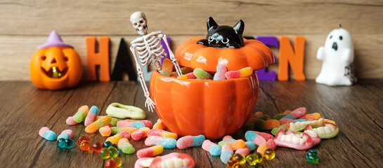 Happy Halloween day with ghost candies, candle, pumpkin, Jack O lantern and decorative (selective focus). Trick or Threat, Hello October, fall autumn, Festive, party and holiday concept