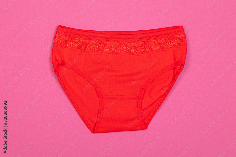 Clothes for children in the form of panties on a pink background. Clothes for children from soft fabric. Panties for girls. Clothes for children in the form of panties on a pink background. Clothes for children from soft fabric. Panties for girls.