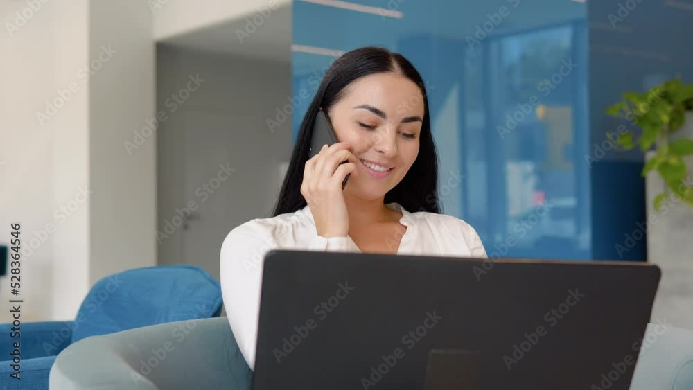 Young business girl working with laptop in coffee shop cafe
