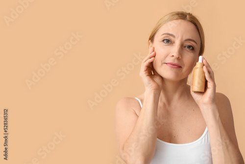 Mature woman with cosmetic ...