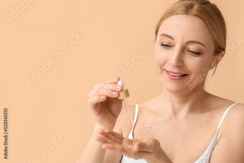 Mature woman with cosmetic ...