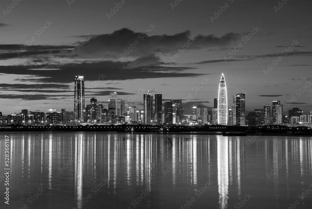 Skyline of Shenzhen city, China at dusk. Viewed from Hong Kong border Lau Fau Shan
