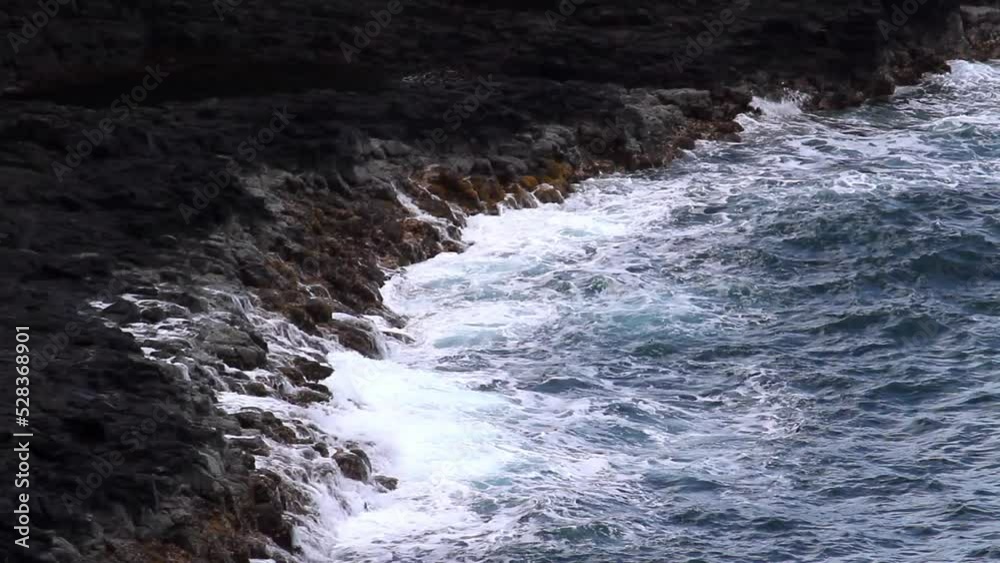 Lockdown Shot Of Ocean Water Splashing On Land - Kauai, Hawaii Lockdown Shot Of Ocean Water Splashing On Land - Kauai, Hawaii