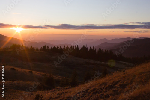 picturesque autumn sunrise image in mountains, autumn morning dawn, nature colorful background, Carpathians mountains, Ukraine, Europe  © Rushvol