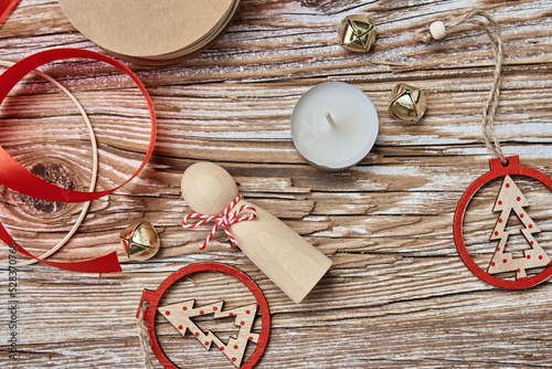 Christmas composition withhandmade toys on wooden background, flat lay photo